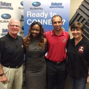 OPEN FOR BUSINESS: Kathy Stone with Camp Bow Wow, Jordan Sandler of Frenik Marketing Group and Courtney Spencer with Gwinnett Chamber of Commerce