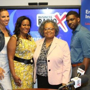 Marilyn Santiago with GSU Robinson College of Business, Regina Mixon Bates with National Black MBA Association and Chaz Jenkins with Welcome to the Wall