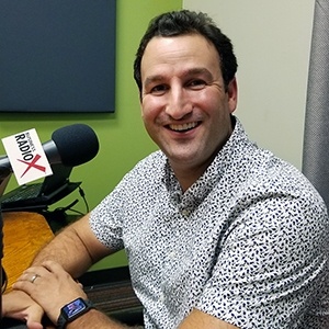 Thanasi Panagiotakopoulos with LifeManaged in the studio at Valley Business RadioX in Phoenix, Arizona