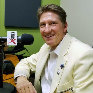 Mike Nealy with the Fiesta Bowl in the studio at Valley Business RadioX in Phoenix, Arizona