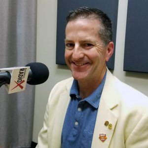 Patrick Barkley with the Fiesta Bowl in the studio at Valley Business RadioX in Phoenix, Arizona