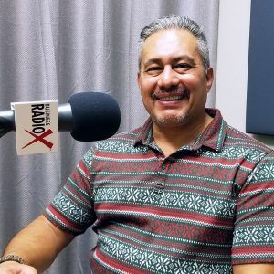 Jeffrey Garza Walker with Cresa in the studio at Valley Business RadioX in Phoenix, Arizona